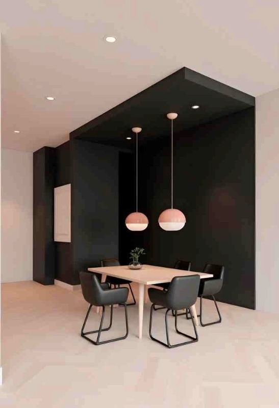 Modern dining room by Interior Decoration Company in Kolkata with black walls and pendant lighting.
