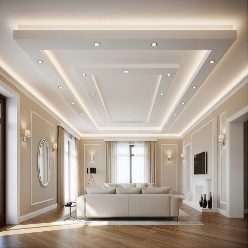 Elegant living room with false ceiling and neutral decor by an Interior Design Firm in Kolkata.